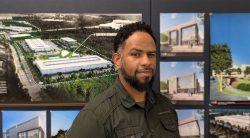 Headshot of an employee in front of a wall of project images